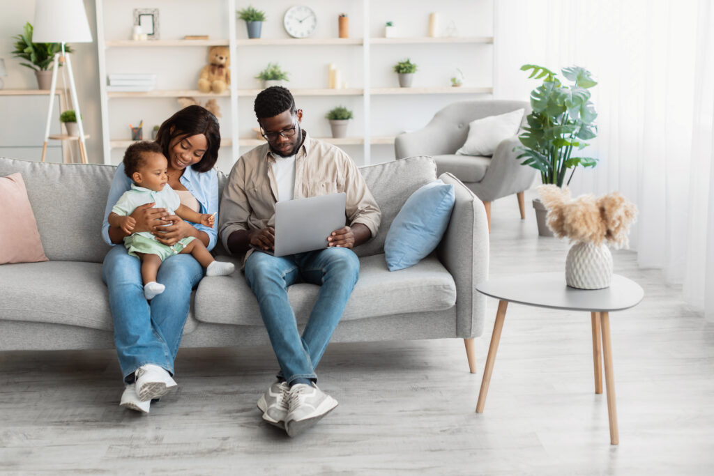 IRS direct file. Family filing their tax return on a computer.