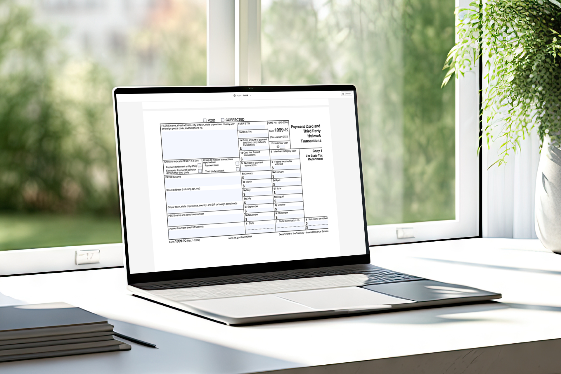 Form 1099-K on laptop.